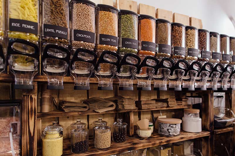 Food dispensers and paper bags in a zero waste food store