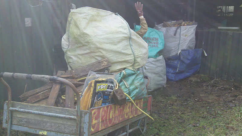 A full wheelbarrow of waste