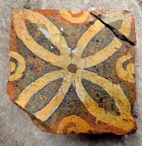A medieval floor tile found on a Hyde900 archeology community dig