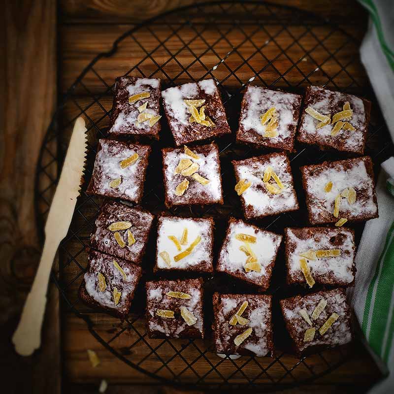 Slices of ginger parkin placed on a cooling rack