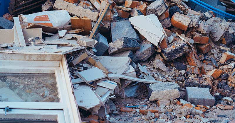 DIY construction waste pile with bricks and a window