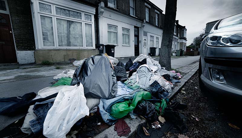 Bin bag waste on a residential pavement