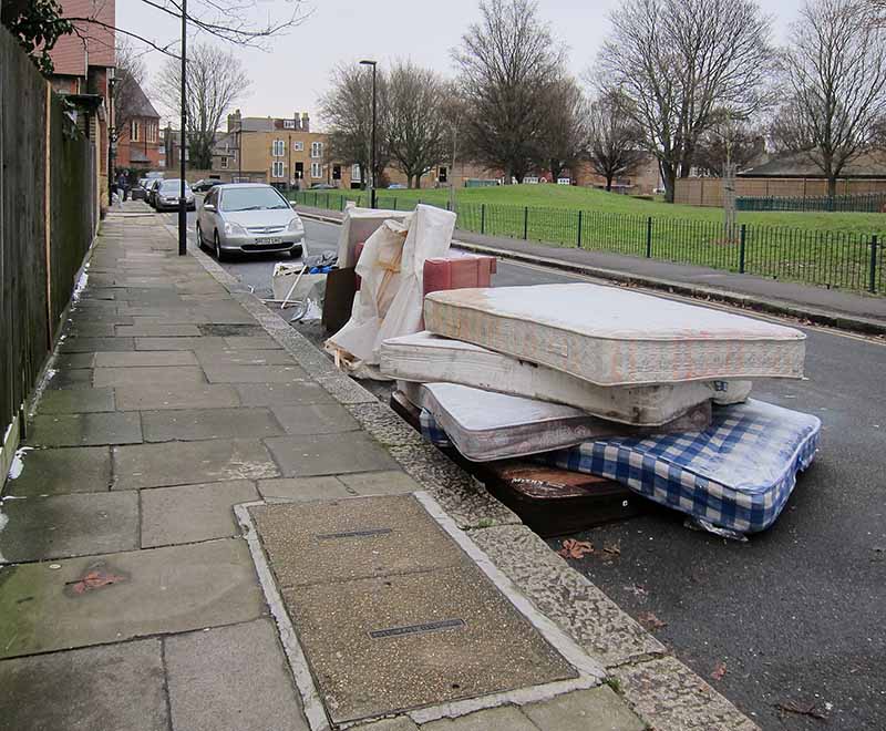 Mattresses dumped on road