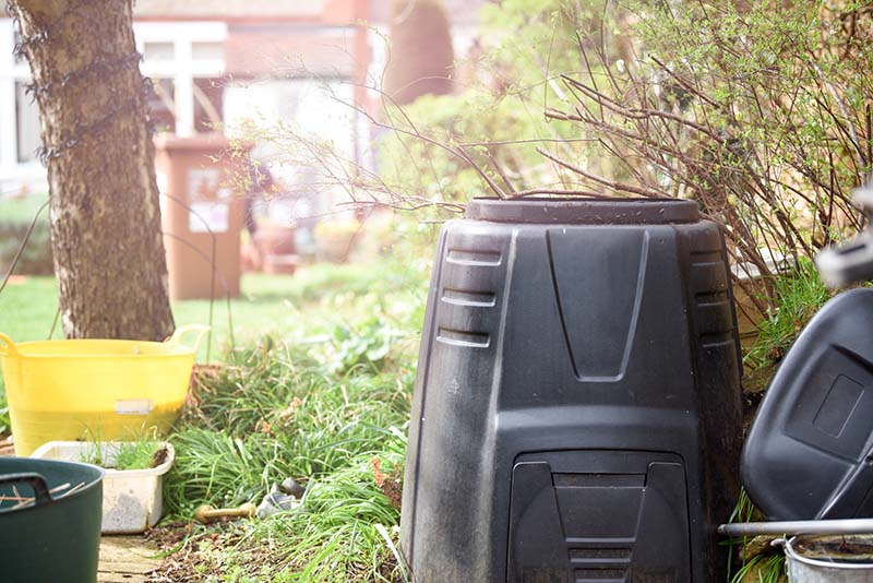 A compost bin in a garden