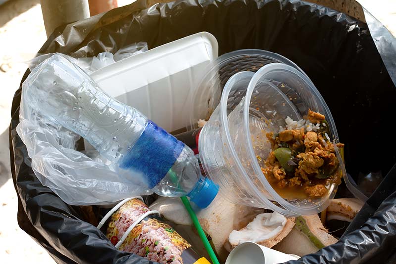 Food waste mixed with recycling waste in a bin