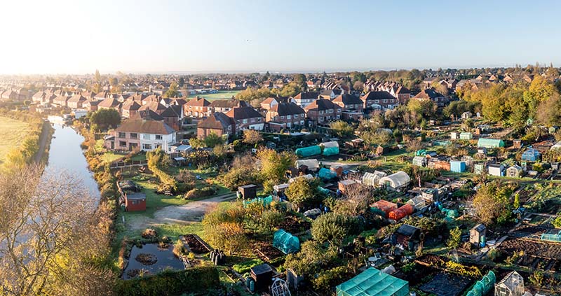 Aerial view of a council allotment community in the UK